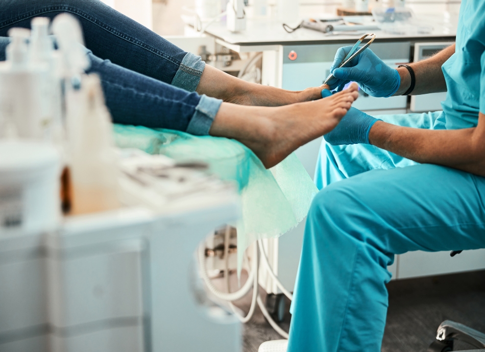 Podiatrist doing medical pedicure on patient's feet